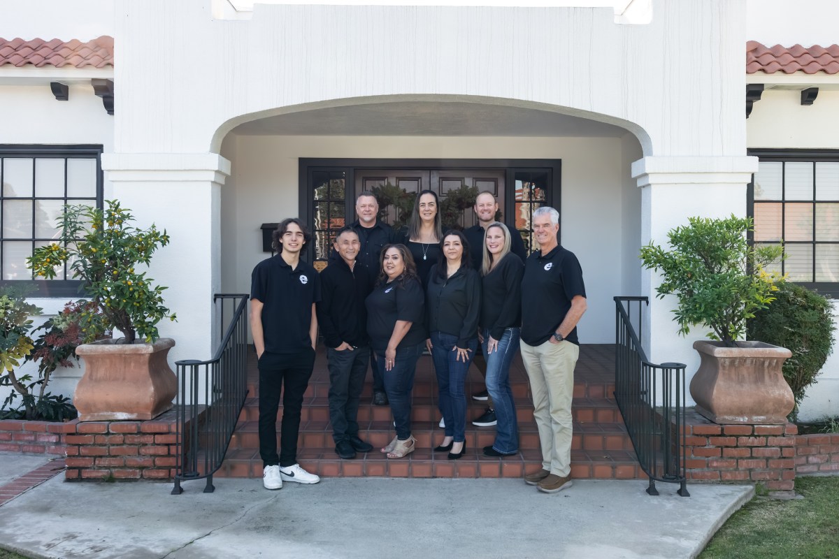 The Elmco Insurance team in front of the Chapman Avenue office